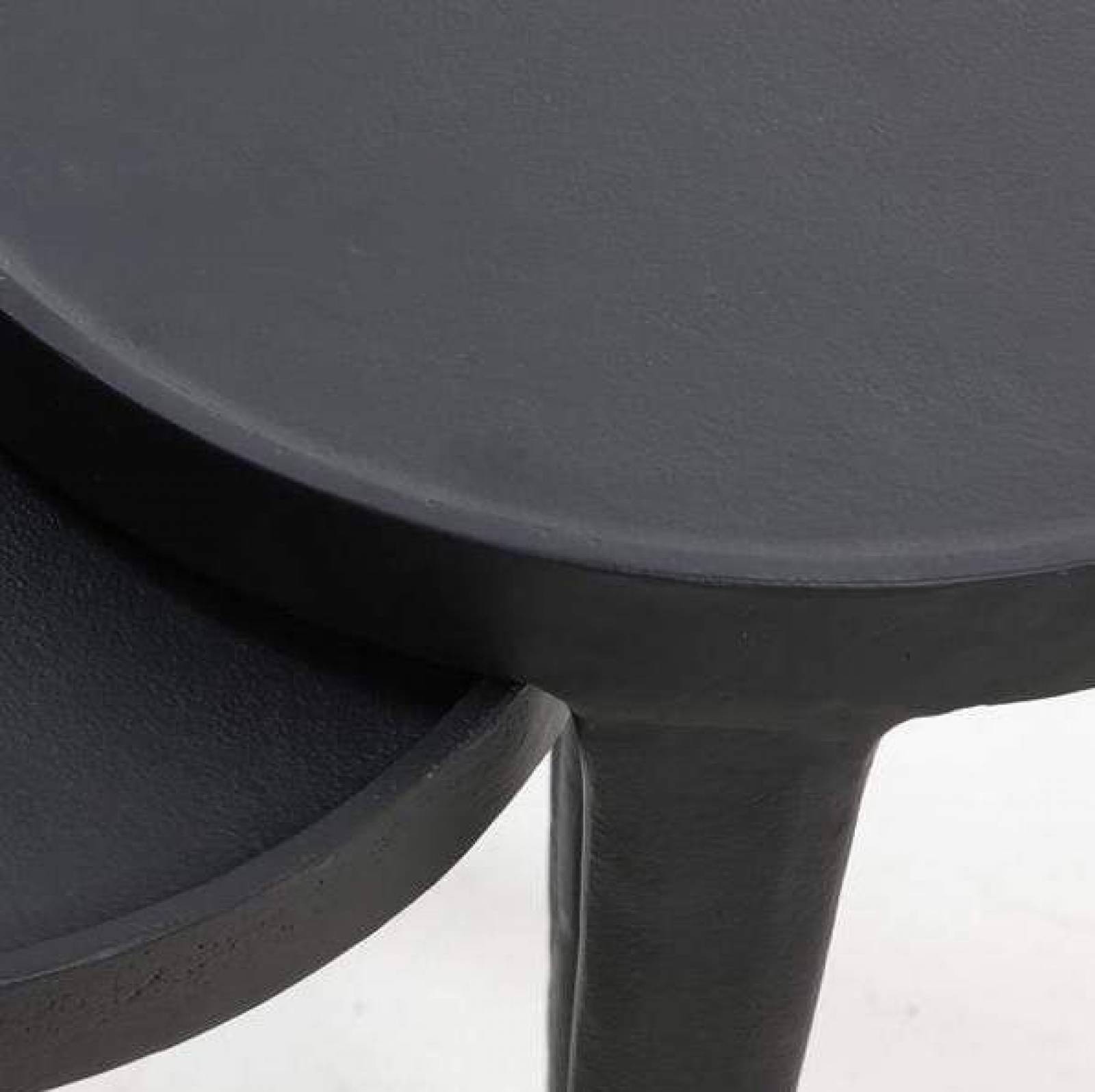 Small round black metal side outlet table